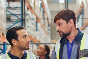 Shop owner reviewing a problem on the production floor